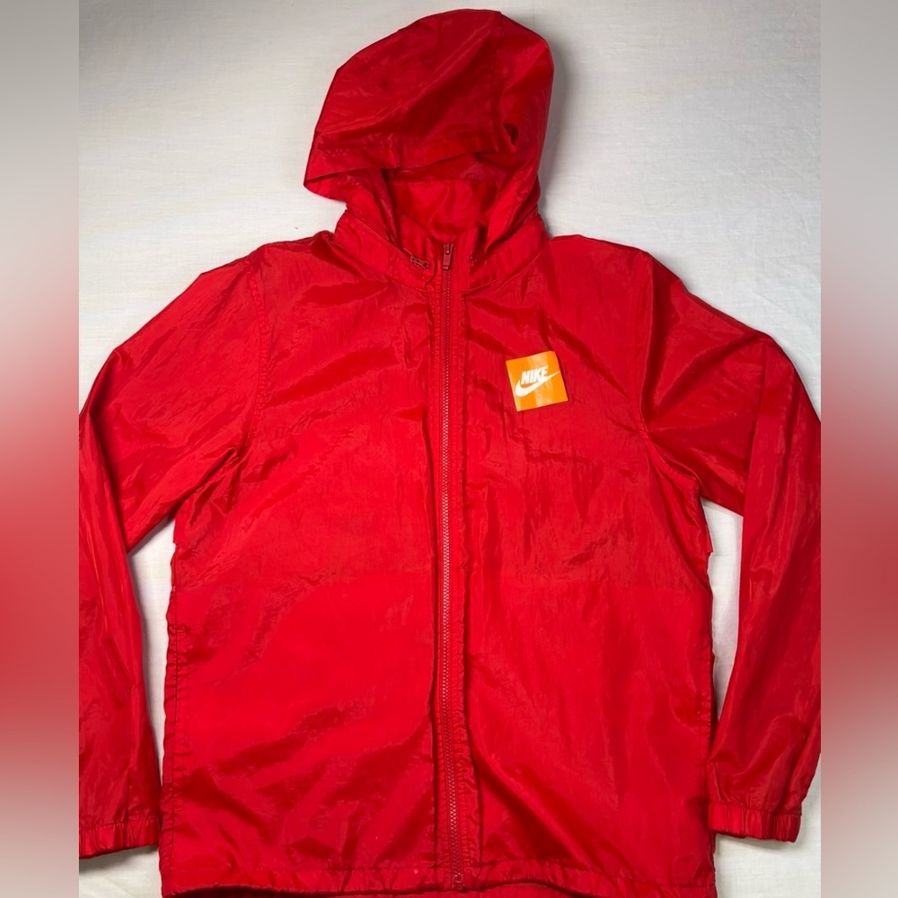 Nike women’s red windbreaker with hidden hoodie and adjustable waist size M